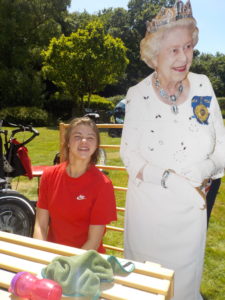 Student with cardboard cutout of Queen celebrating jubilee
